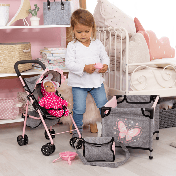 un ensemble d'accessoires pour bébé, comme une poussette, un